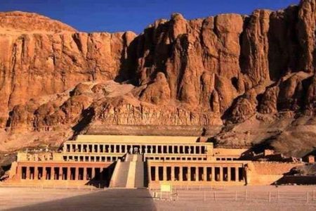 Terraced colonnades of the Mortuary Temple of Hatshepsut rising against the desert cliffs of Deir el-Bahari in Luxor