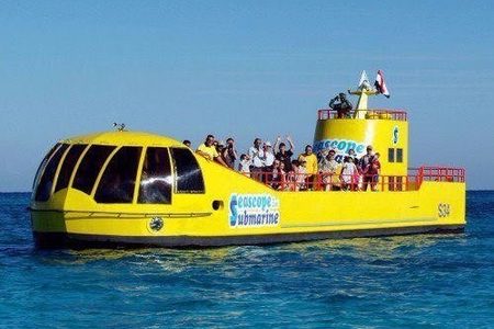 Yellow Sea Scope semi-submarine boat with passengers on the upper deck on turquoise water off Hurghada